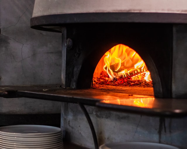 a stone fire oven in a commercial kitchen